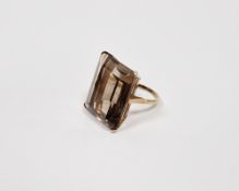 Gold-coloured metal and smoky quartz dress ring set large rectangular cut stone, the stone 25mm x