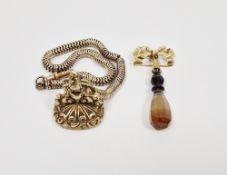 Gold-coloured metal and agate seal bow brooch, the bow suspension with banded agate cut small seal