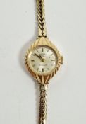 Lady’s Rotary 9ct gold wristwatch, the circular face with engraved case, on integral herringbone-