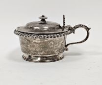 A William IV circular silver mustard and cover, the hinged cover with knop finial, shell and foliate