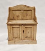 19th century pine hall seat raised over a two-door cupboard, 98cm high x 73cm wide x 42cm deep