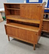 Nathan teak highboard sideboard with an open bookcase section next flanked by fall front door, above