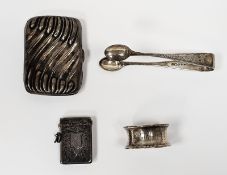Silver vesta case, Chester 1899, of rectangular form with engraved foliate scroll decoration, a