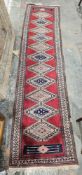 Eastern red ground runner with one row of 12 lozenges of alternating colurs, multiple geometric