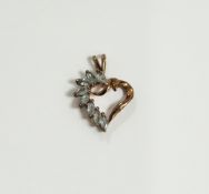 9ct gold and green stone harp-shaped pendant set with elliptical green stones, the green stones