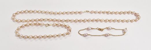 String of pale pink freshwater pearls with matching bracelet and a pearl and gold bracelet marked
