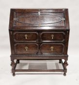 20th century oak bureau, the fall front opening to reveal various pigeonholes and drawers, over a