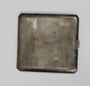 Elizabeth II silver cigarette case with Art Deco-style engine-turned decoration, gilt interior,