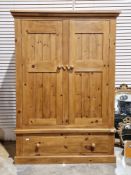 Pine two-door wardrobe over a single long drawer, 185cm high x 130cm wide x 60cm deep