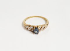 9ct gold, green stone and diamond ring set oval green stone and small diamonds in rows to the