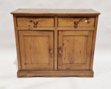 Victorian pine sideboard having two short drawers over a two-door cupboard, 86cm high x 104cm wide x