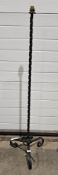 Modern iron standard lamp, the twist column on three legs, 127cm high