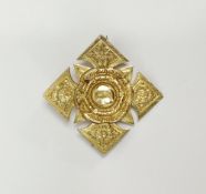Victorian 15ct gold brooch of circular flowerhead and square cutaway form, floral engraved with