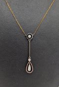 9ct white gold, yellow gold and diamond necklace, having collet set circular pendant above