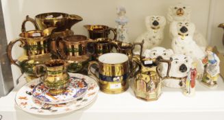 Collection of Staffordshire pottery including a group of copper lustre jugs, a two-handled loving