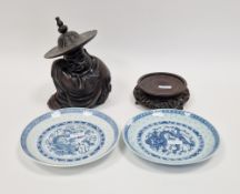 Chinese carved hardwood figure of a crouching man in wide brimmed hat, probably 19th century, 17cm
