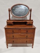 Late Victorian/Edwardian oak dressing chest with oval bevel-edged swing mirror, two jewel drawers,