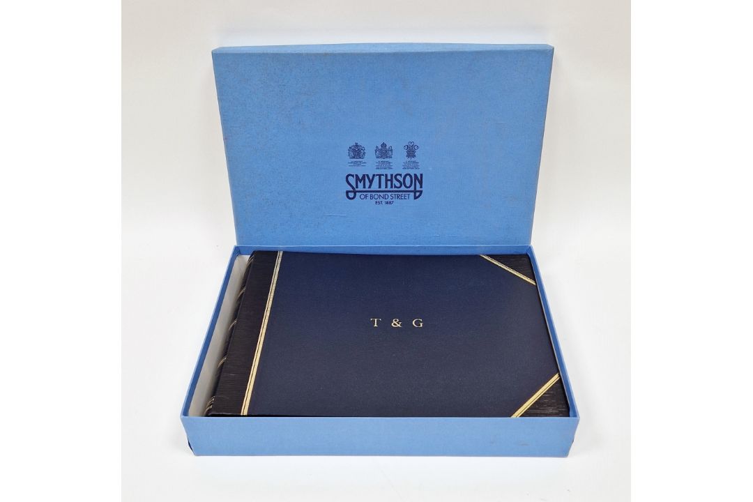 Smythson of Bond Street, dark blue, crushed morocco photo album, gilt rules, initialled T & G on