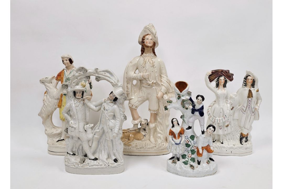 Collection of Victorian Staffordshire pottery flatback figures including a large figure of a