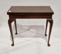 Georgian-style mahogany folding rectangular games table, the hinged top with floral tapestry cover