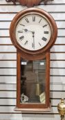 Late 19th/early 20th century oak-cased drop dial wall clock having Roman numerals, glazed case
