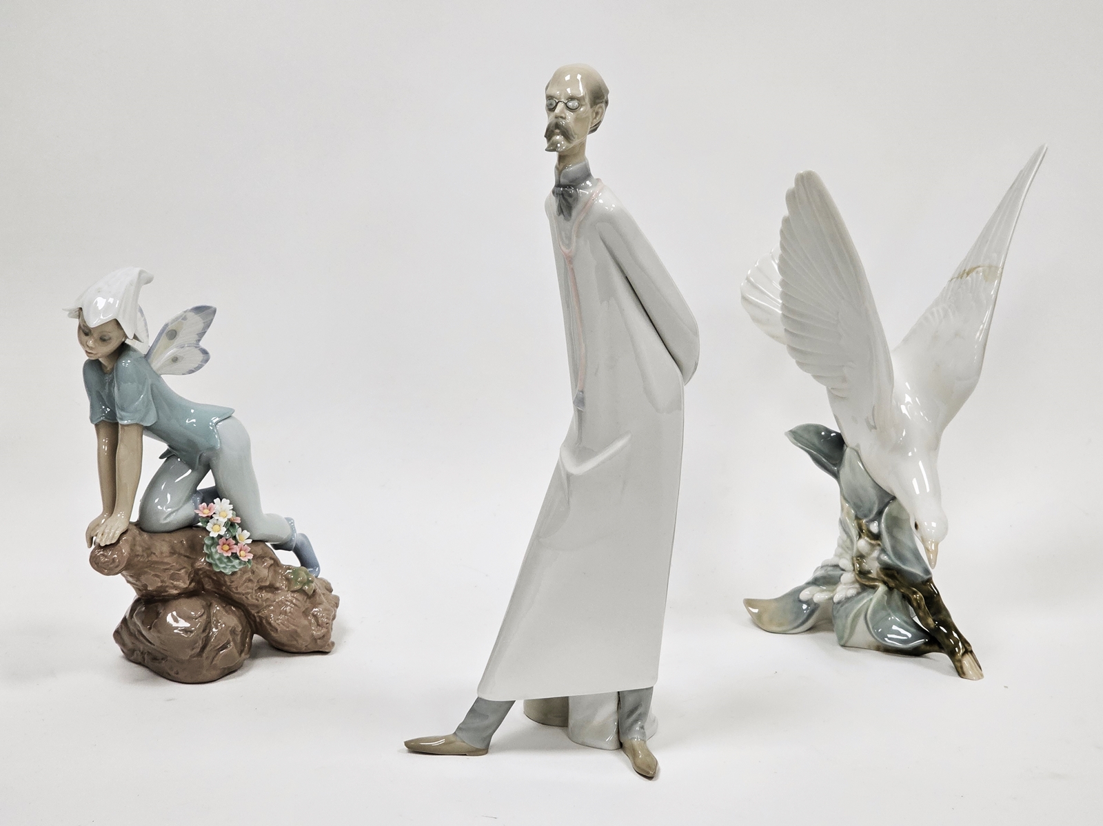 Lladro figure of the Prince of Elves, a model of a turtle dove and a figure of a doctor, 34.5cm