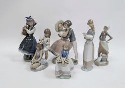 Six Lladro figures including a boy kissing a girl, little girl holding a basket of flowers,