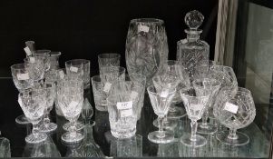 Various items of cut glass tableware including wine glasses in sizes, brandy balloons, water