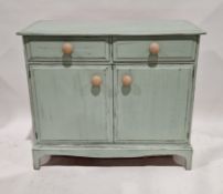 Vintage sage green distressed painted kitchen cupboard, with two frieze drawers above two panelled