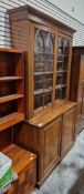 Late Victorian mahogany bookcase with two glazed doors opening to reveal adjustable shelves, over