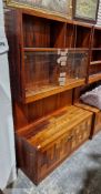 20th century veneered sideboard, the top with two shelves over a two glazed door cupboards, 182cm