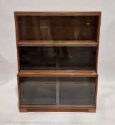 Three-section stacking glazed bookcase, each tier with two sliding glass doors, 114cm high x 89cm