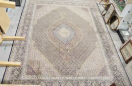 Large Persian wool carpet with concentric scalloped lozenge arabesques to the field, each with