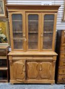 Pine kitchen dresser, the top section with glazed panels and two cupboard doors opening to reveal