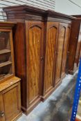 Victorian mahogany four-door wardrobe having moulded cornice and brass escutcheons, 216cm high x