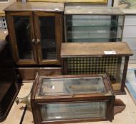 Wall cabinet with bevelled glass sides, fitted brass corners to the front opening drawer and a brass