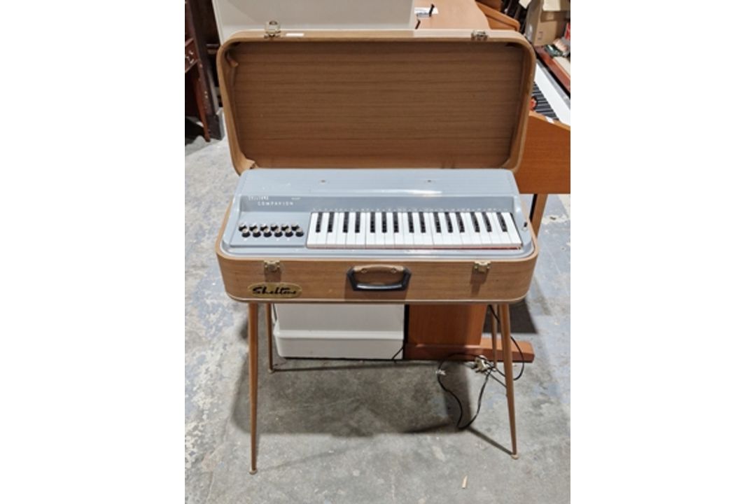 1950's/60's Sheltone companion major electric organ in fibre case and on slender circular tapering