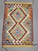 Chobi cream ground kilim,  with two central lozenges on geometric zig-zag field with single
