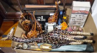 Small collection of wooden carved giraffes, a pair of silver-coloured wire pictures of Eastern