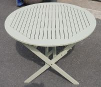 Pale green painted garden table, round, folding,  by 'Hartman', 100cm x 110cm