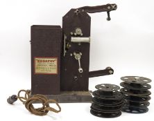 Kodatoy Universal Model 16mm Projector circa 1930's, with a quantity of kodak empty film reels