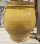Yellow glazed confit pot with wooden lid