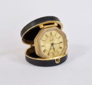 Dunhill gilt metal and leather travel clock, the gilt octagonal face, no.1829, within circular black