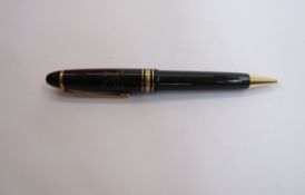 Montblanc Meisterstuck ball point pen, black with gold band decoration, engraved lion crest and name