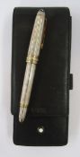 Montblanc Meisterstuck silver fountain pen, ribbed silver case with gold band detailing,