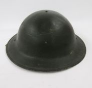 WWI British Army Brodie helmet mark 2, stone cannonball and iron spearhead.