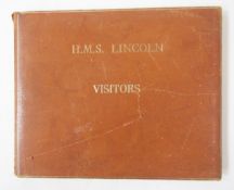 Leather covered visitor's book for the frigate HMS Lincoln, together with a framed crest.