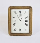 Dunhill brass desk clock, rectangular with rounded corners, engine-turned frame to the white
