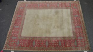 Large wool carpet of revived Eastern style, having stiff leaf and floral spray iron red border and