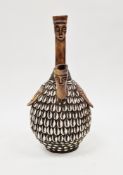 African gourd pipe, possibly from the Congo, comprising a shell covered gourd and bone pipes